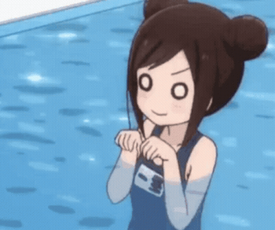 A Girl In A Swimsuit Is Standing Next To A Pool . GIF