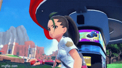 A Girl In A Video Game Is Standing In Front Of A Sign That Says Tomy GIF