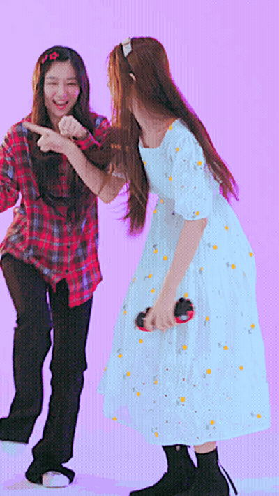 A Girl In A White Dress Is Dancing With Another Girl GIF