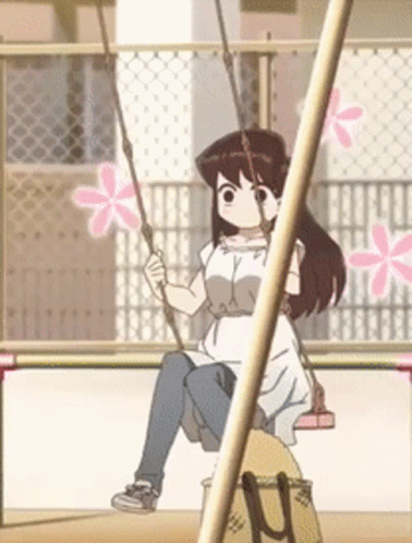 A Girl In A White Dress Is Sitting On A Swing GIF
