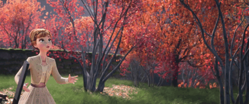 A Girl In A White Dress Is Standing In A Forest With Red Leaves GIF