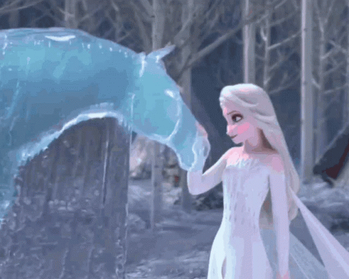 A Girl In A White Dress Touches The Nose Of A Blue Ice Horse GIF