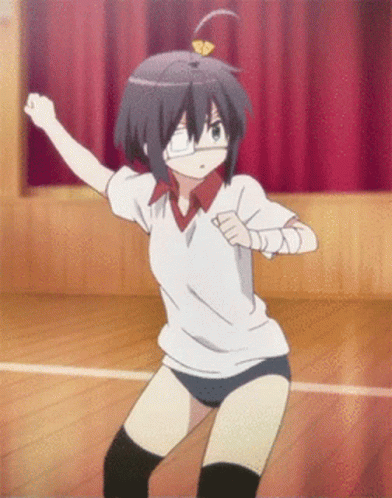 A Girl In A White Shirt And Blue Shorts Is Dancing In A Gym GIF