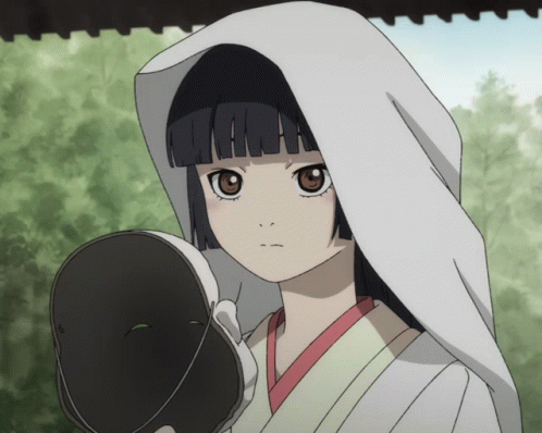 A Girl In A White Veil Is Holding A Mask GIF
