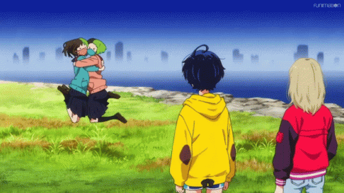 A Girl In A Yellow Hoodie Is Hugging Another Girl In A Green Jacket GIF