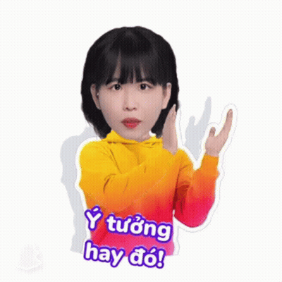 A Girl In A Yellow Hoodie Is Making A Peace Sign With Her Hand . GIF