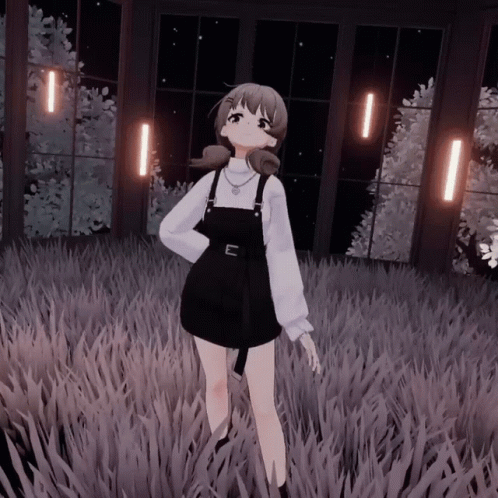 A Girl In Overalls And A White Shirt Stands In A Field GIF