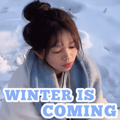 A Girl In The Snow With The Words " Winter Is Coming " Above Her GIF