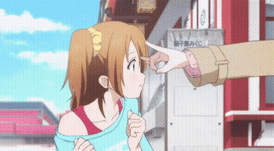 A Girl Is Being Touched By A Person 'S Hand In Front Of A Sign That Says ' A ' On It GIF