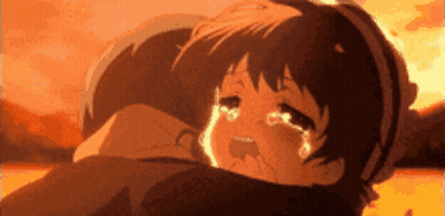 A Girl Is Crying While Being Held By A Man In A Cartoon . GIF