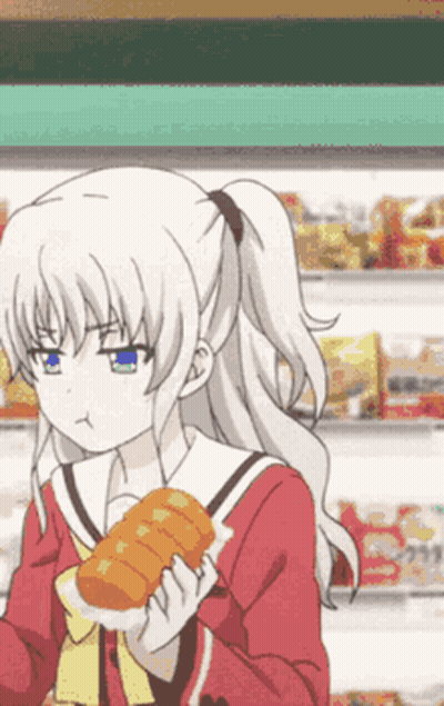 A Girl Is Holding A Loaf Of Bread In Her Hands GIF