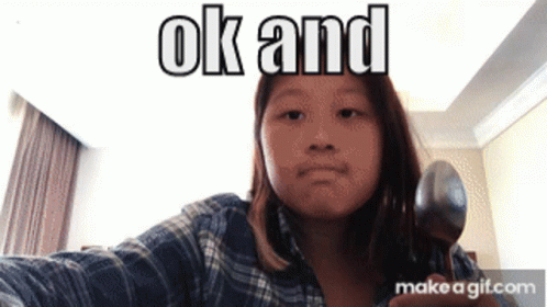 A Girl Is Holding A Spoon In Front Of A Screen That Says Ok And Make A Gif.com GIF