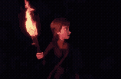 A Girl Is Holding A Torch In Her Hand In The Dark GIF