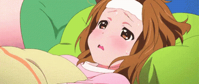 A Girl Is Laying In Bed With A Thermometer On Her Head GIF