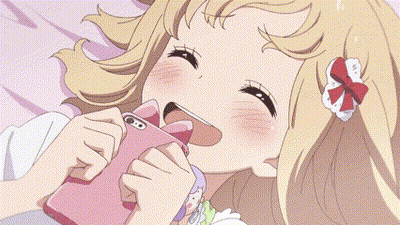 A Girl Is Laying On A Bed In A Room With A Desk And A Table . GIF