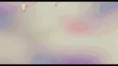 A Girl Is Laying On A Bed With A Red Blanket With Flowers On It GIF