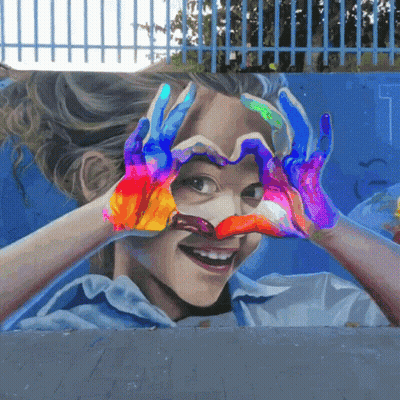A Girl Is Making A Heart Shape With Her Hands GIF