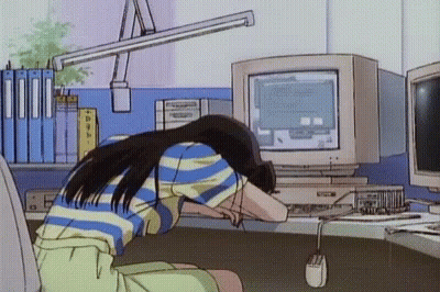 A Girl Is Sitting In Front Of A Computer With Her Head On The Desk GIF