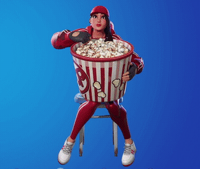A Girl Is Sitting On A Stool Holding A Bucket Of Popcorn GIF