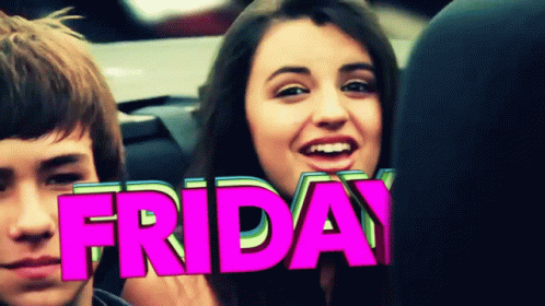 A Girl Is Smiling In Front Of A Pink Friday Sign GIF