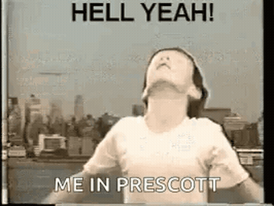 A Girl Is Standing In Front Of A City Skyline With Her Arms Outstretched And Says `` Hell Yeah ! '' GIF