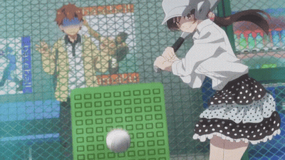 A Girl Is Swinging A Bat At A Baseball Behind A Fence GIF