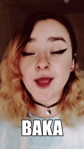 A Girl Is Wearing A Choker And Making A Funny Face With The Word Baka On Her Face . GIF