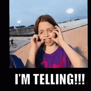 A Girl Making A Funny Face With The Words " I 'M Telling " Below Her GIF