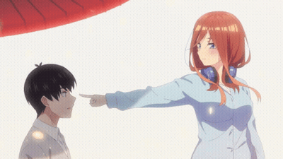 A Girl Pointing At A Boy In A Blue Shirt GIF