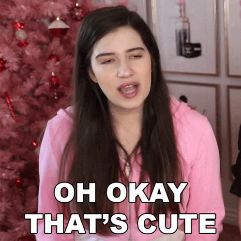 A Girl Says Oh Okay That 'S Cute In Front Of A Pink Tree GIF