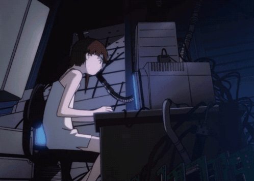 A Girl Sits At A Desk In Front Of A Computer Screen GIF