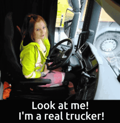 A Girl Sitting In A Truck With The Words Look At Me I 'M A Real Trucker Below Her GIF