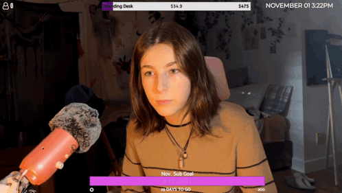 A Girl Sitting In Front Of A Microphone With The Date November 01 3:22 Pm On The Bottom GIF