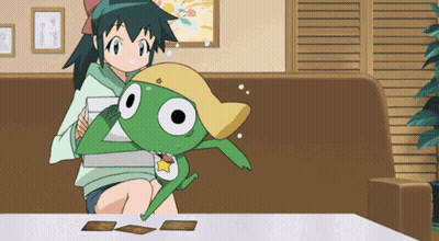 A Girl Sitting On A Couch Holding A Frog GIF