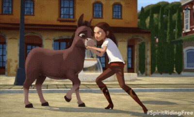 A Girl Standing Next To A Donkey With The Hashtag Spiritridingfree GIF