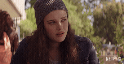 A Girl Wearing A Beanie And A Denim Jacket With Netflix Written On The Bottom GIF