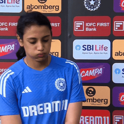 A Girl Wearing A Blue Shirt That Says Dream11 GIF