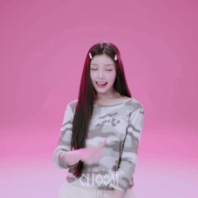 A Girl Wearing A Camouflage Shirt With The Word Studio On The Front GIF
