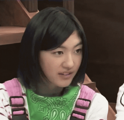 A Girl Wearing A Green Bandana And A Pink Shirt With The Letter D On It GIF