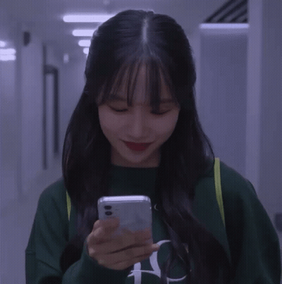 A Girl Wearing A Green Sweatshirt With The Letter N On It GIF