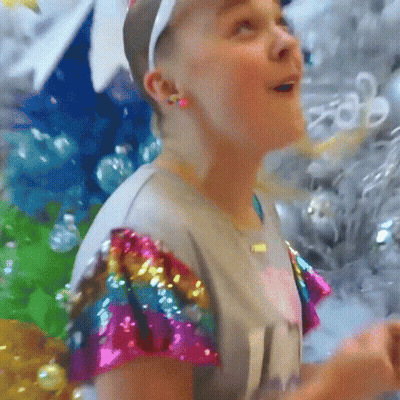 A Girl Wearing A Headband And A Shirt That Says ' I 'M A Girl ' On It GIF