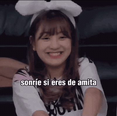 A Girl Wearing A Headband With Bunny Ears Smiles And Says Sonrie Si Eres De Amita . GIF