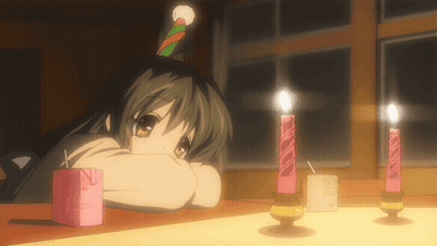 A Girl Wearing A Party Hat Is Looking At Candles GIF
