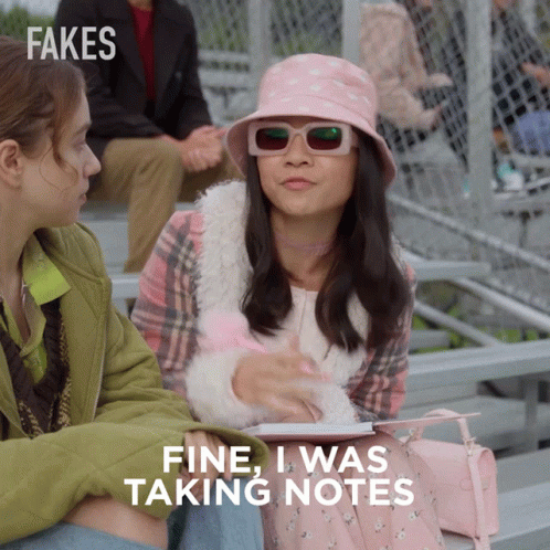 A Girl Wearing A Pink Hat And Sunglasses Is Sitting Next To Another Girl And Says Fine I Was Taking Notes GIF