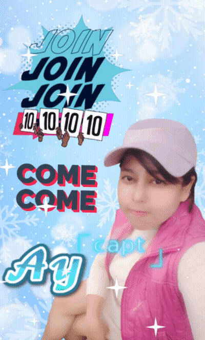 A Girl Wearing A Pink Vest And A Pink Hat Stands In Front Of A Sign That Says Join Join GIF
