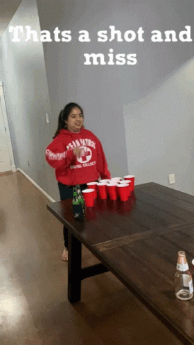 A Girl Wearing A Red Sweatshirt That Says Penn State On It GIF