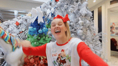 A Girl Wearing A Shirt That Says Jingle Lowns GIF