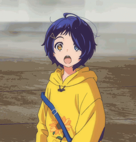 A Girl Wearing A Yellow Hoodie With A Sunflower On The Front GIF