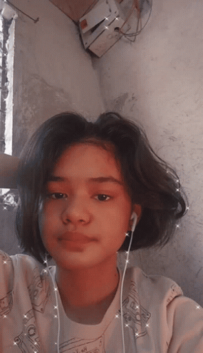 A Girl Wearing Ear Buds And A Shirt That Says ' I Love You ' On It GIF