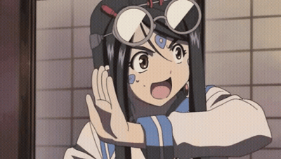 A Girl Wearing Glasses And A Helmet Is Making A Funny Face GIF